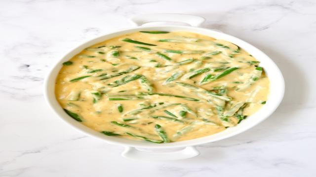 Green beans with cheese sauce poured over