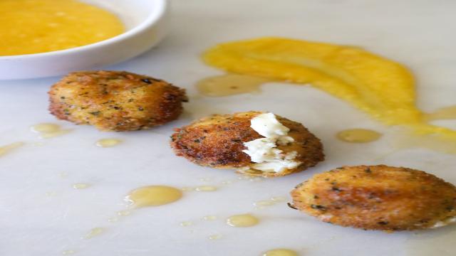 Three goat cheese balls fried with a mango dipping sauce.