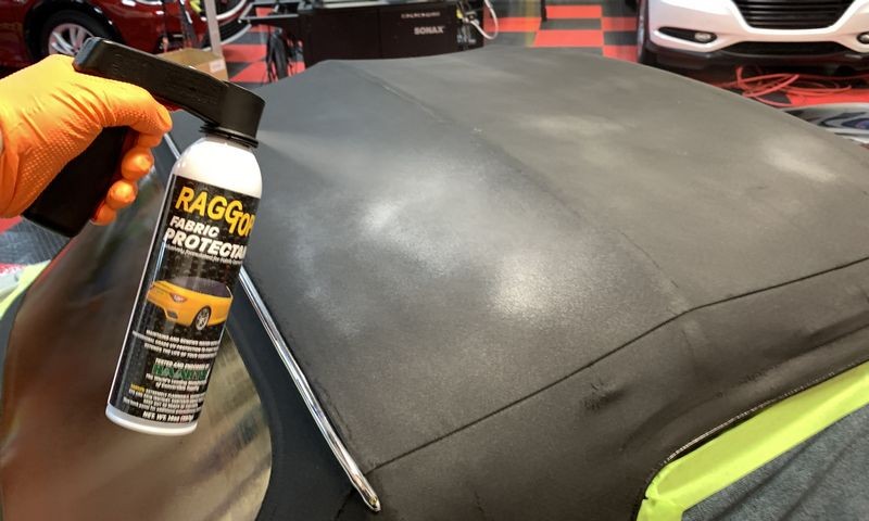 Spraying second can onto convertible top